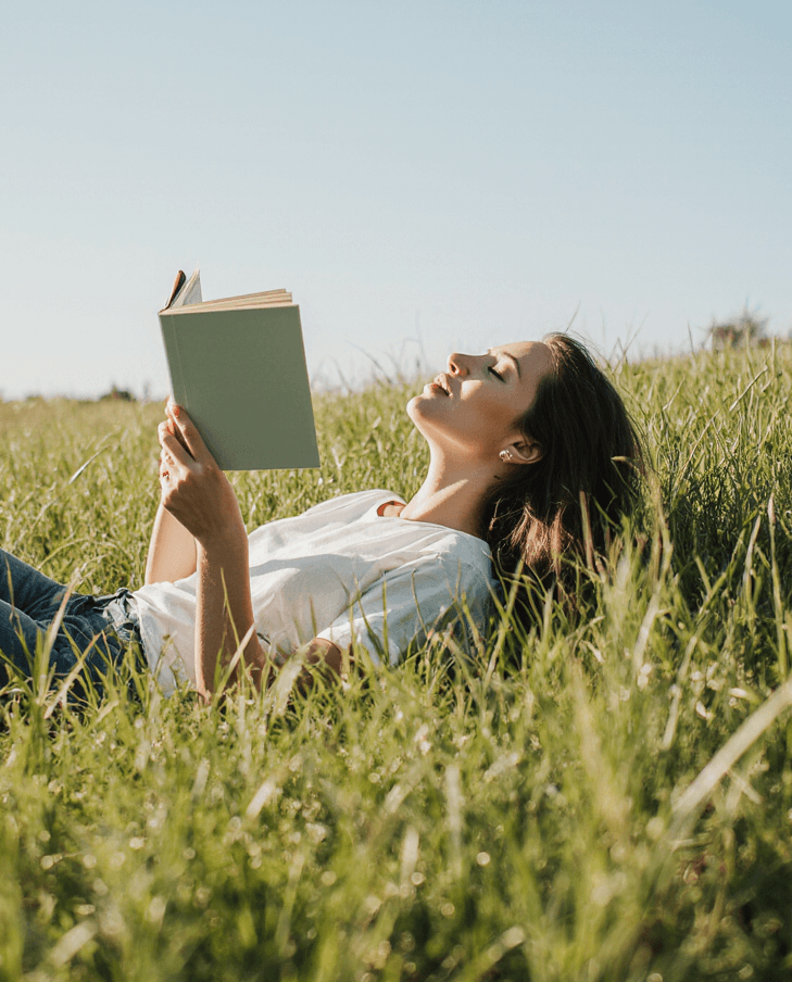 Person reading, cozy sunlight in background